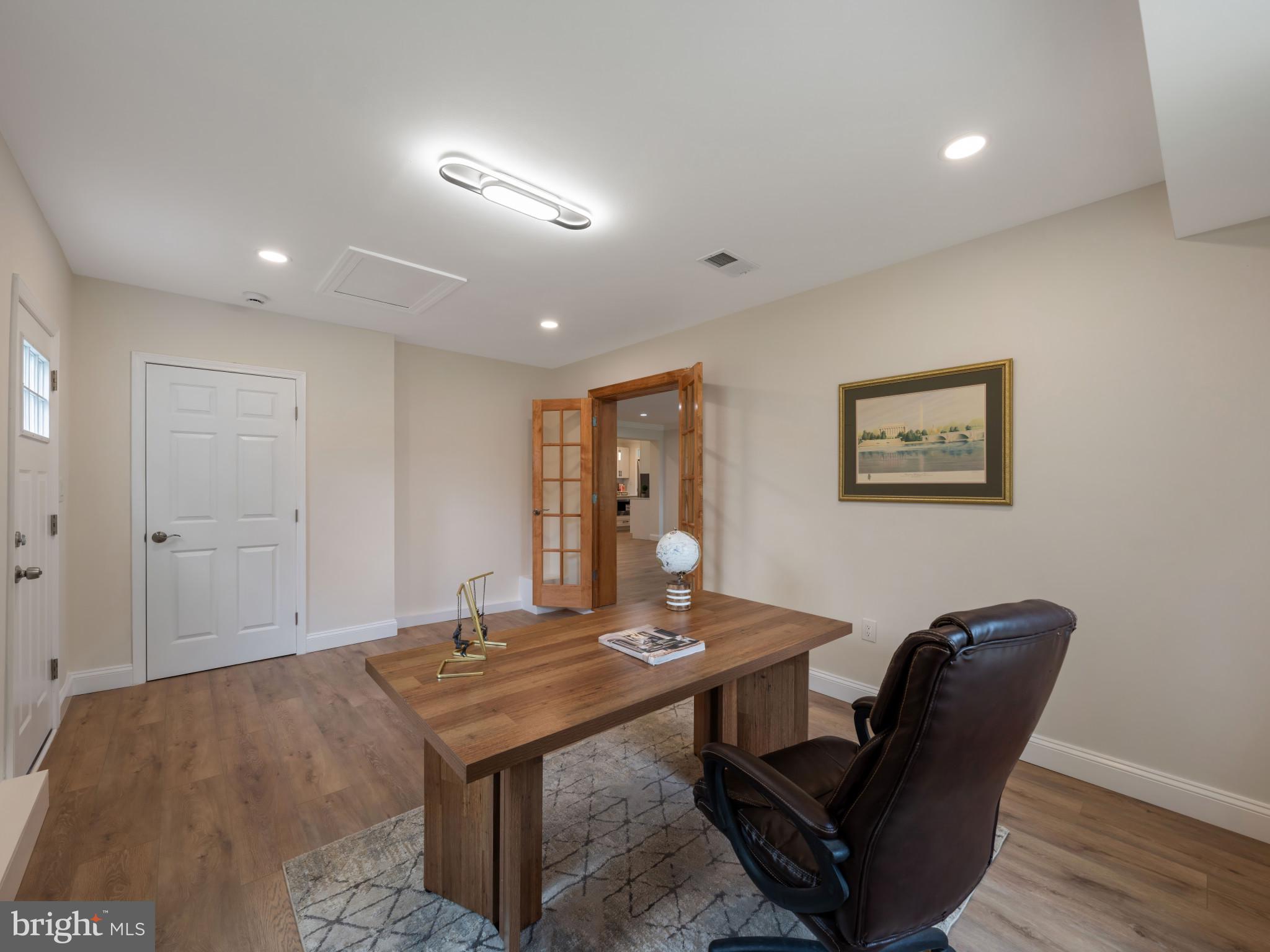5503 Blacksburg Road Springfield, VA 22151 - Photo 26 of 30 a living room with furniture a table and wooden floor
