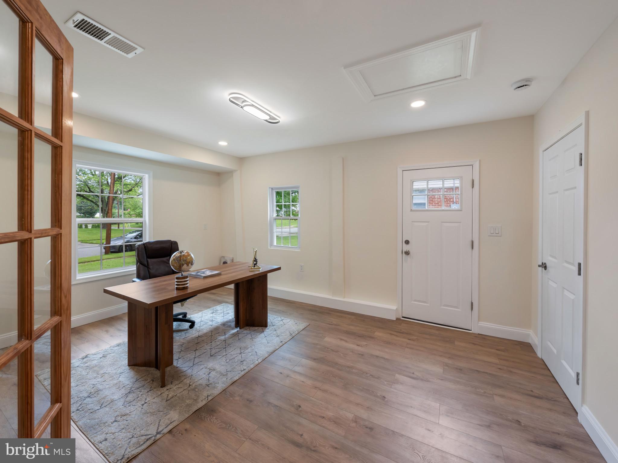 5503 Blacksburg Road Springfield, VA 22151 - Photo 27 of 30 a view of a workspace with furniture and a window