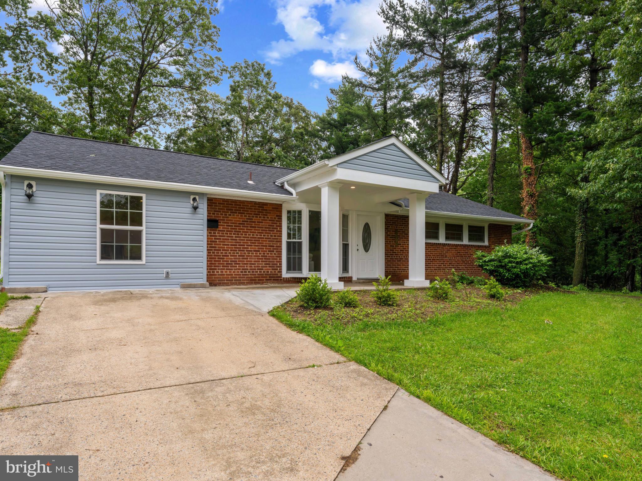 5503 Blacksburg Road Springfield, VA 22151 - Photo 30 of 30 a front view of a house with a yard and garage