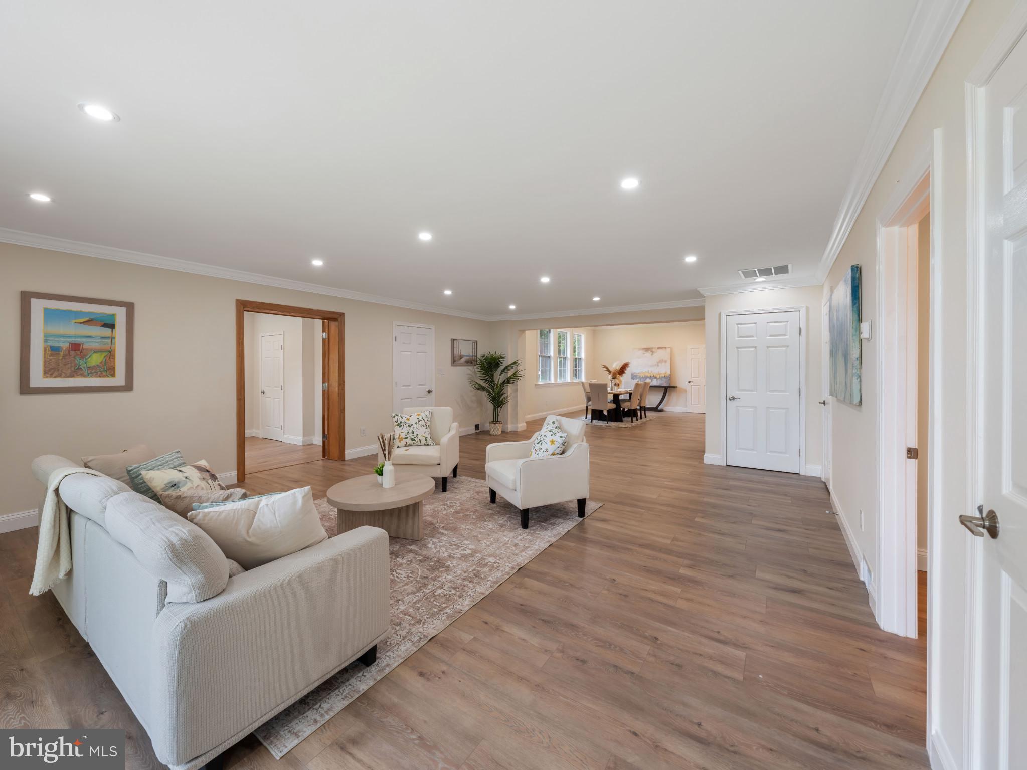 5503 Blacksburg Road Springfield, VA 22151 - Photo 4 of 30 a living room with furniture and a wooden floor