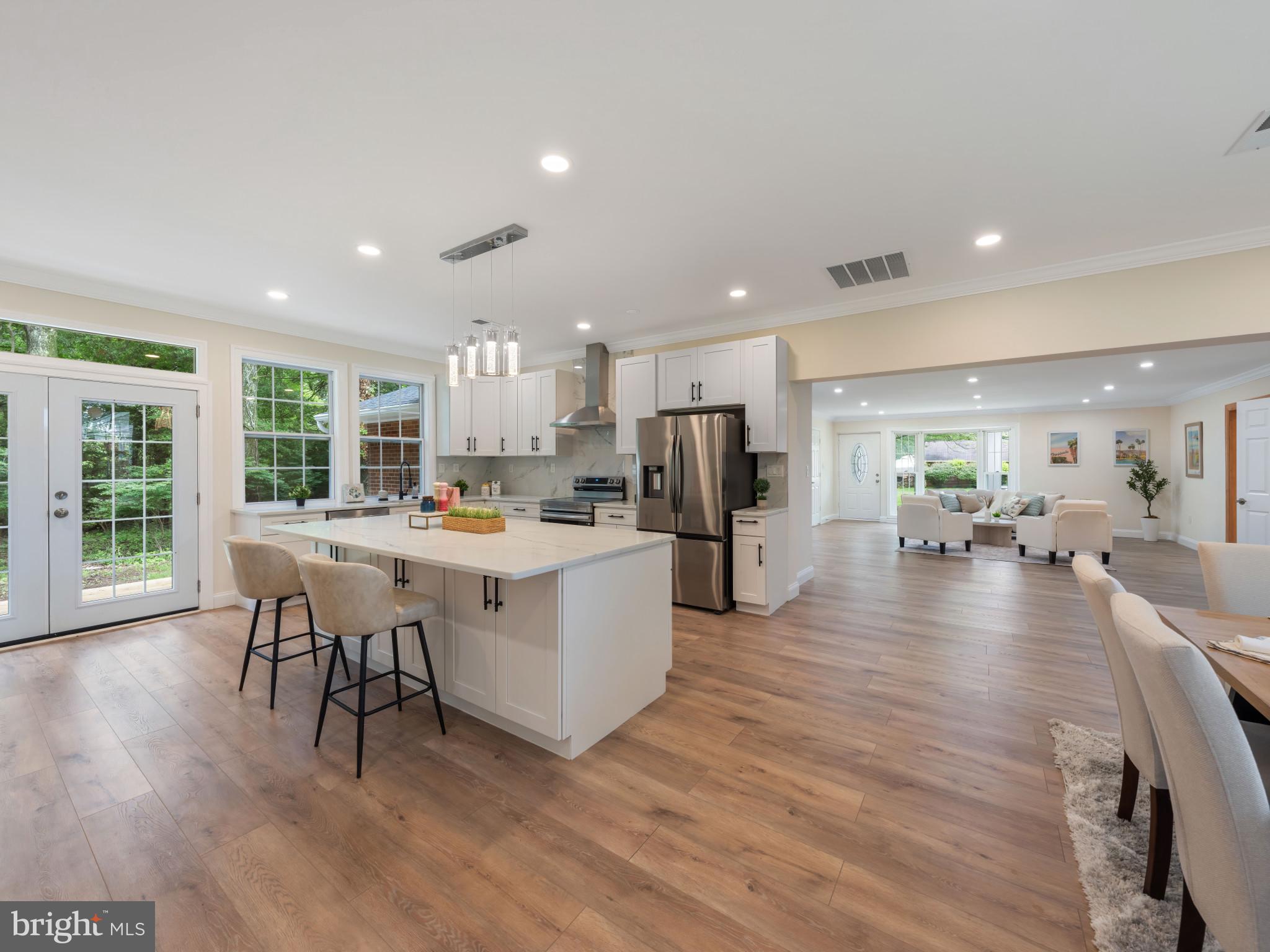 5503 Blacksburg Road Springfield, VA 22151 - Photo 5 of 30 a kitchen with a table chairs refrigerator and dining table