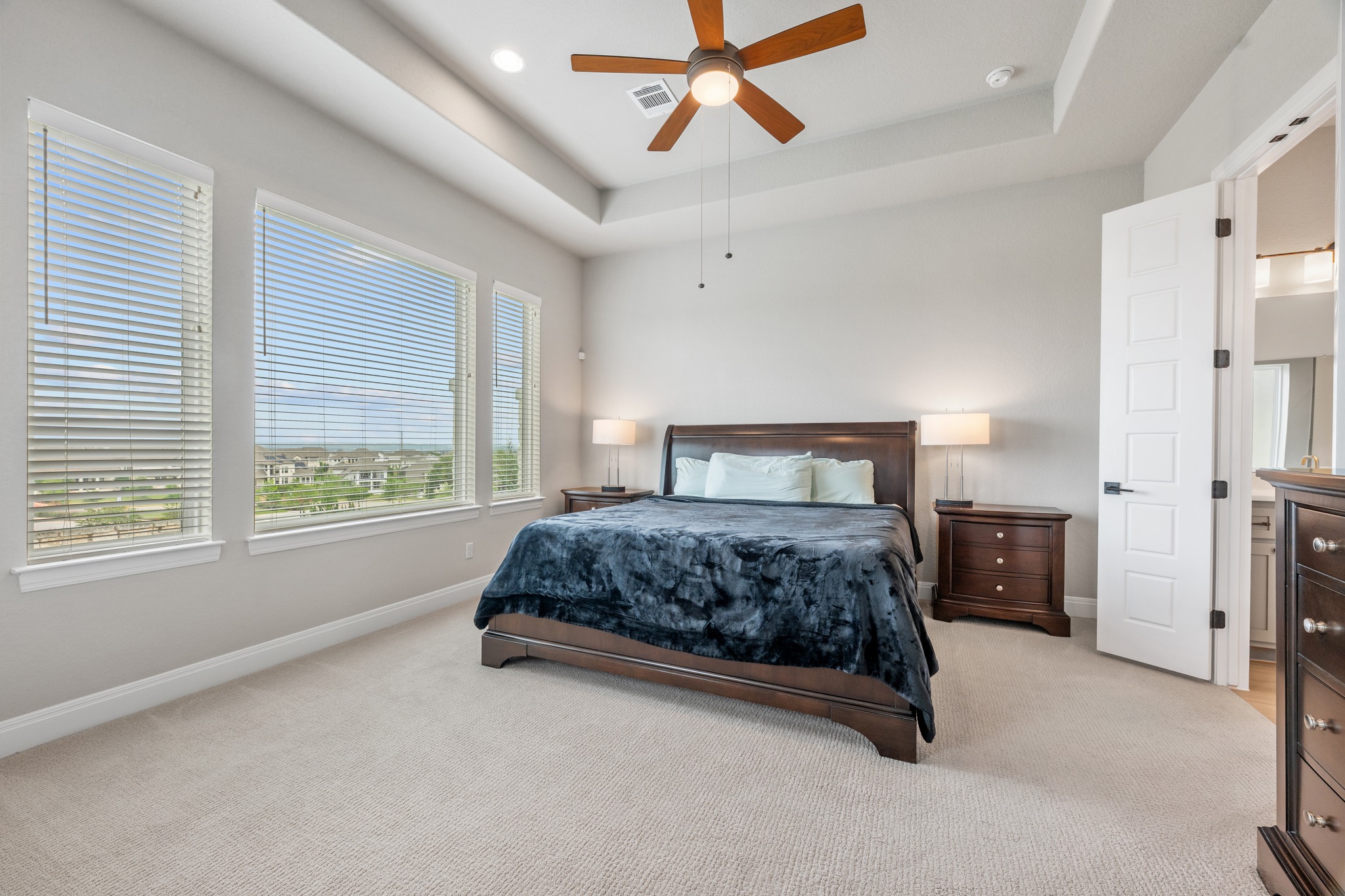 510 Elworth Path Austin, TX 78738 - Photo 10 of 40 a bedroom with a large bed and a window