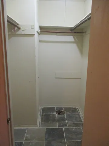 a view of a room with racks on the wall