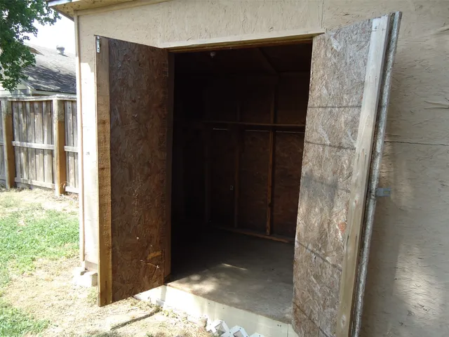 a bathroom with a shower and a sink