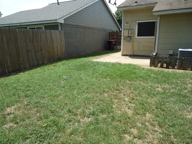 a view of a backyard of the house