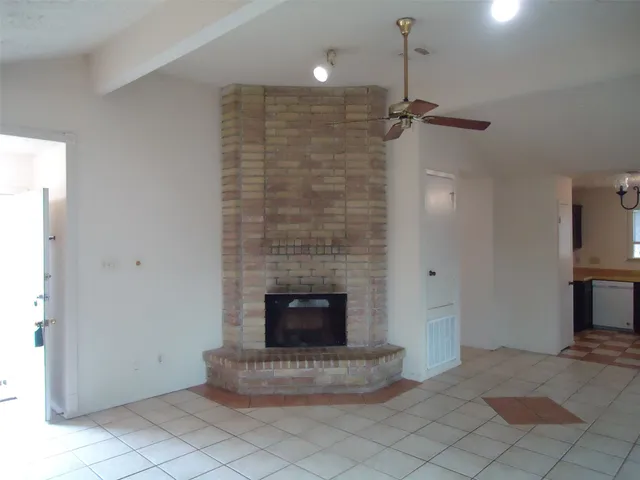 a kitchen with a stove a sink and a microwave