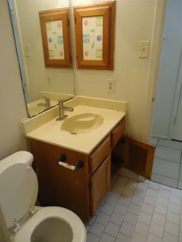 a bath tub sitting next to a white sink