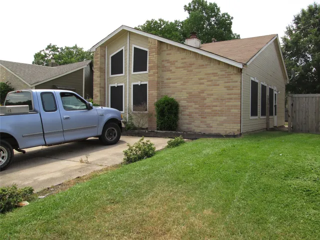 a house view with a garden space