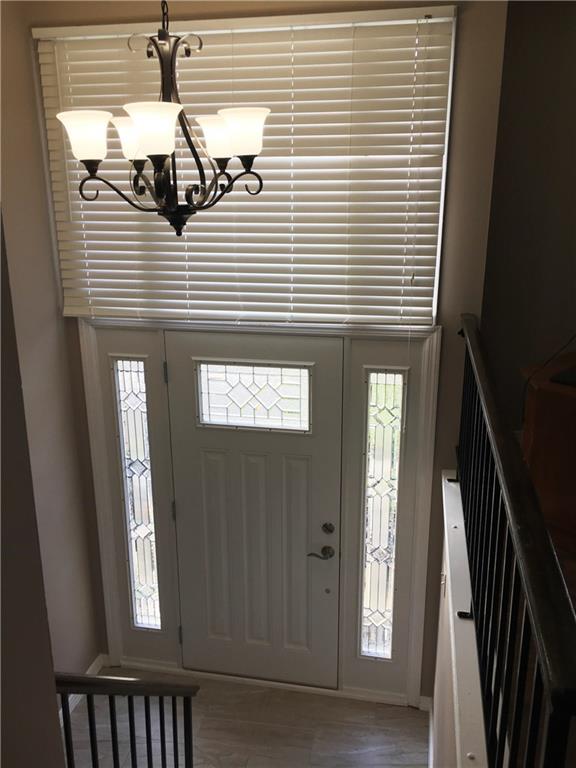 483 Tivoli Road Pittsburgh, PA 15239 - Photo 2 of 24 The newly updated entry features porcelain tile, freshly stained stairs, new paint, new chandelier.