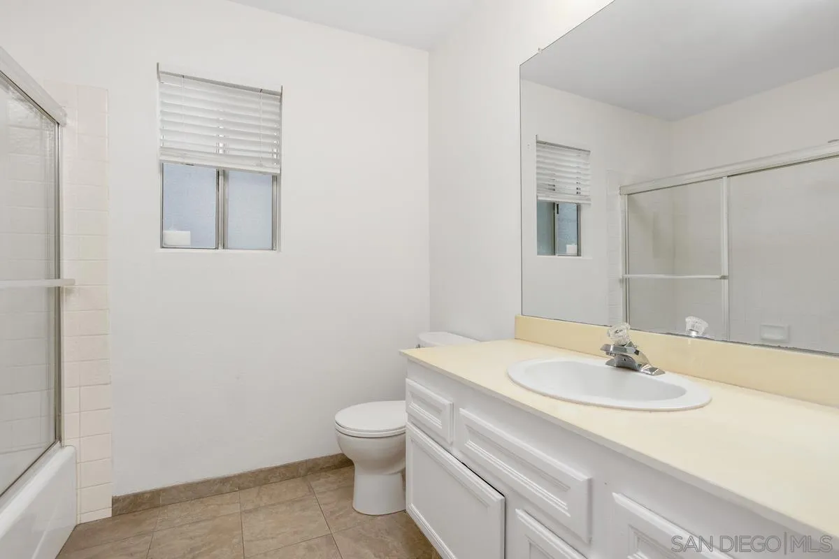 4617 Sheridan Road Oceanside, CA 92056 - Photo 18 of 39 a bathroom with a sink toilet and vanity