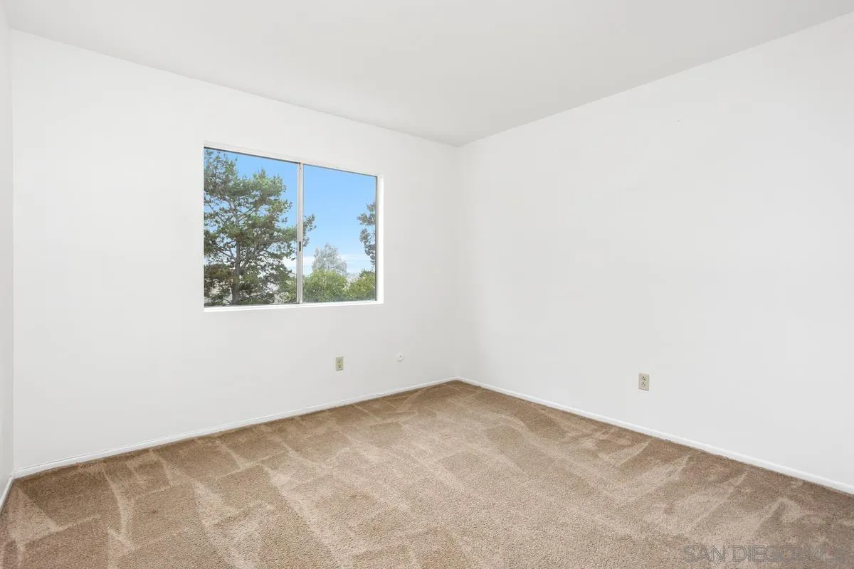 4617 Sheridan Road Oceanside, CA 92056 - Photo 20 of 39 an empty room with a window