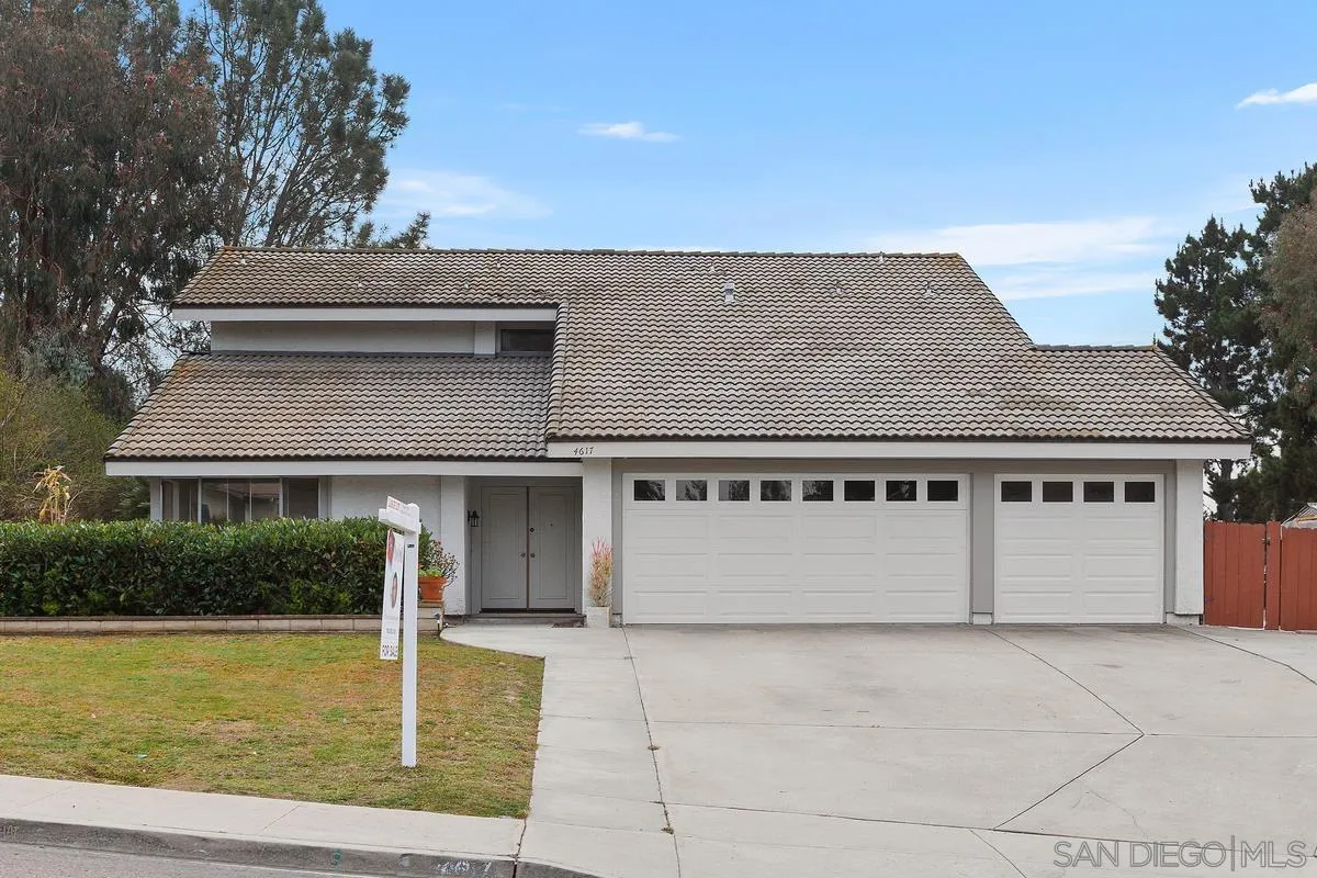 4617 Sheridan Road Oceanside, CA 92056 - Photo 2 of 39 a front view of a house with a yard