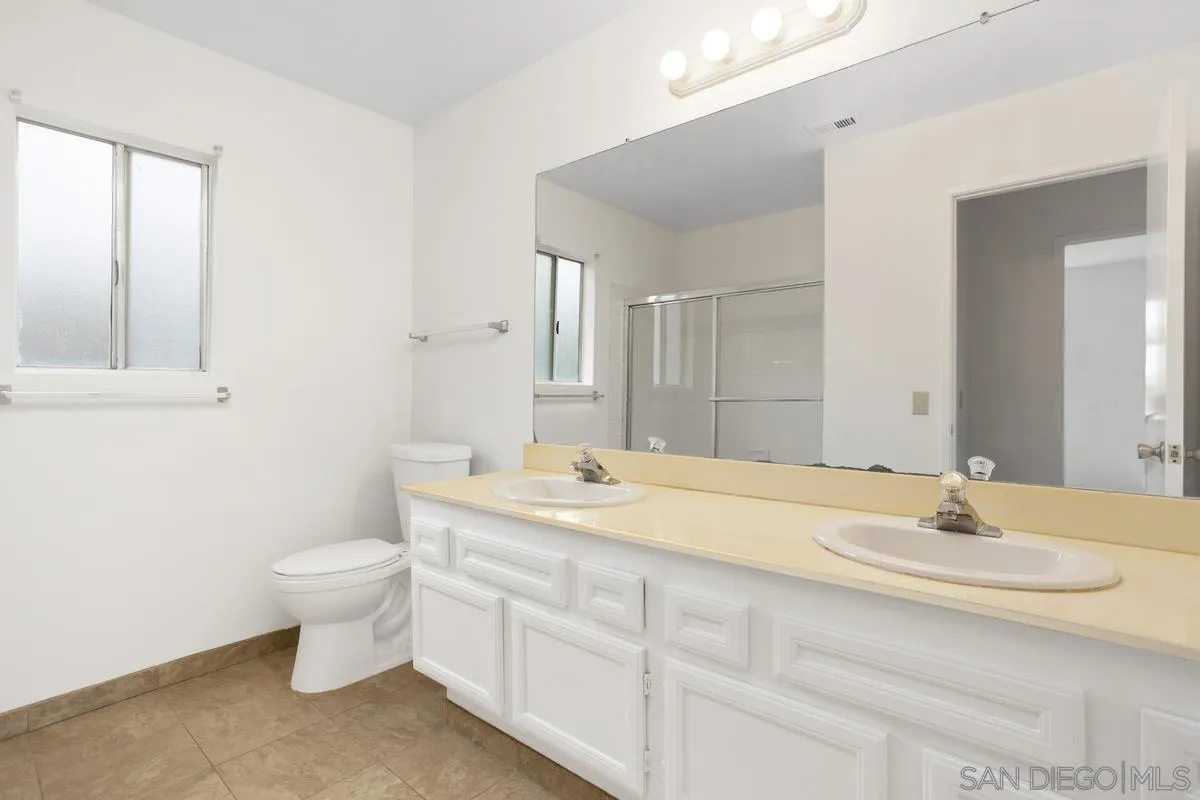 4617 Sheridan Road Oceanside, CA 92056 - Photo 25 of 39 a bathroom with a sink and a toilet