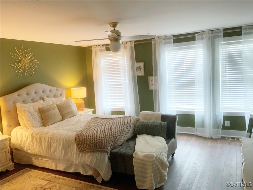 4324 Saunders Station Loop, Unit A Henrico, VA 23233 - Photo 15 of 30 a bedroom with a bed and wooden floor