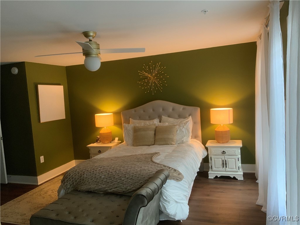 4324 Saunders Station Loop, Unit A Henrico, VA 23233 - Photo 16 of 30 a bedroom with a bed and wooden floor