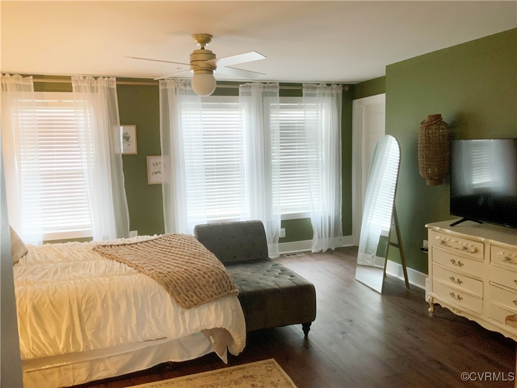4324 Saunders Station Loop, Unit A Henrico, VA 23233 - Photo 19 of 30 a bedroom with a bed and wooden floor