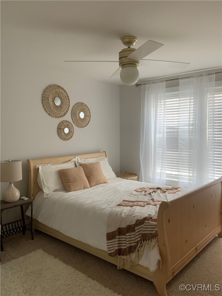 4324 Saunders Station Loop, Unit A Henrico, VA 23233 - Photo 25 of 30 a bedroom with a bed and a window