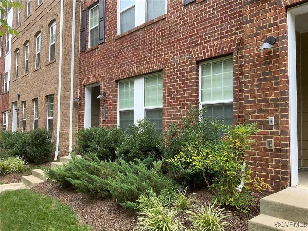 4324 Saunders Station Loop, Unit A Henrico, VA 23233 - Photo 3 of 30 a view of a building next to a yard