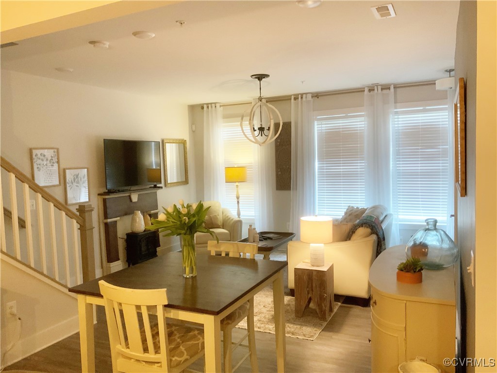 4324 Saunders Station Loop, Unit A Henrico, VA 23233 - Photo 7 of 30 a dining room with furniture and a flat screen tv