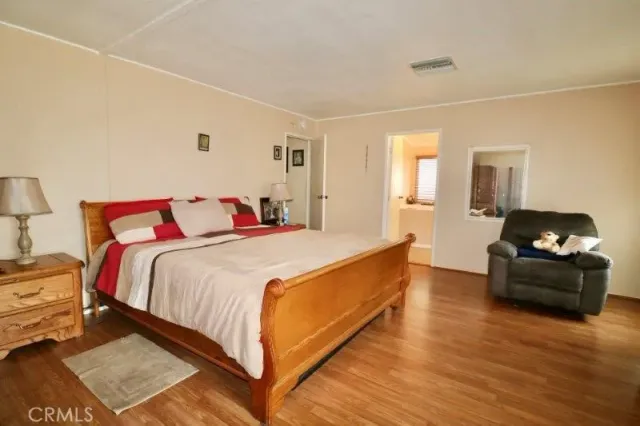 a bathroom with a granite countertop sink mirror and shower