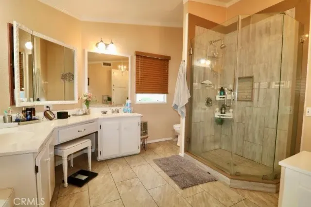a bathroom with a sink vanity and mirror