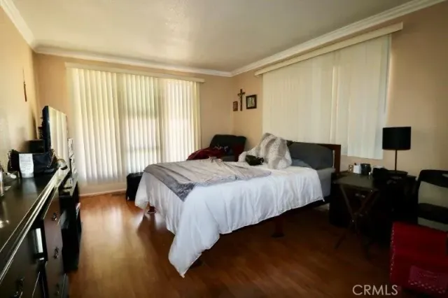 a bedroom with bed and a closet