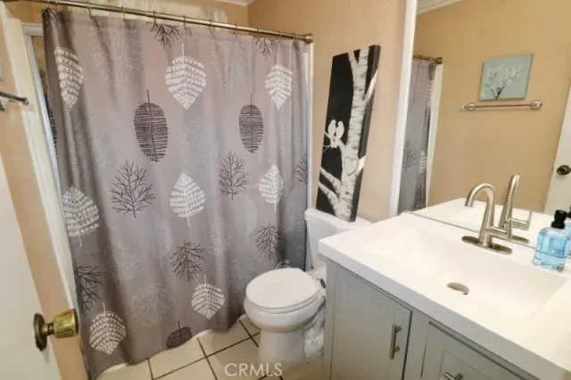a bathroom with a tub a sink and vanity