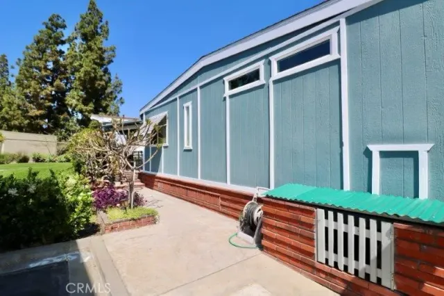 a view of a backyard with sitting area