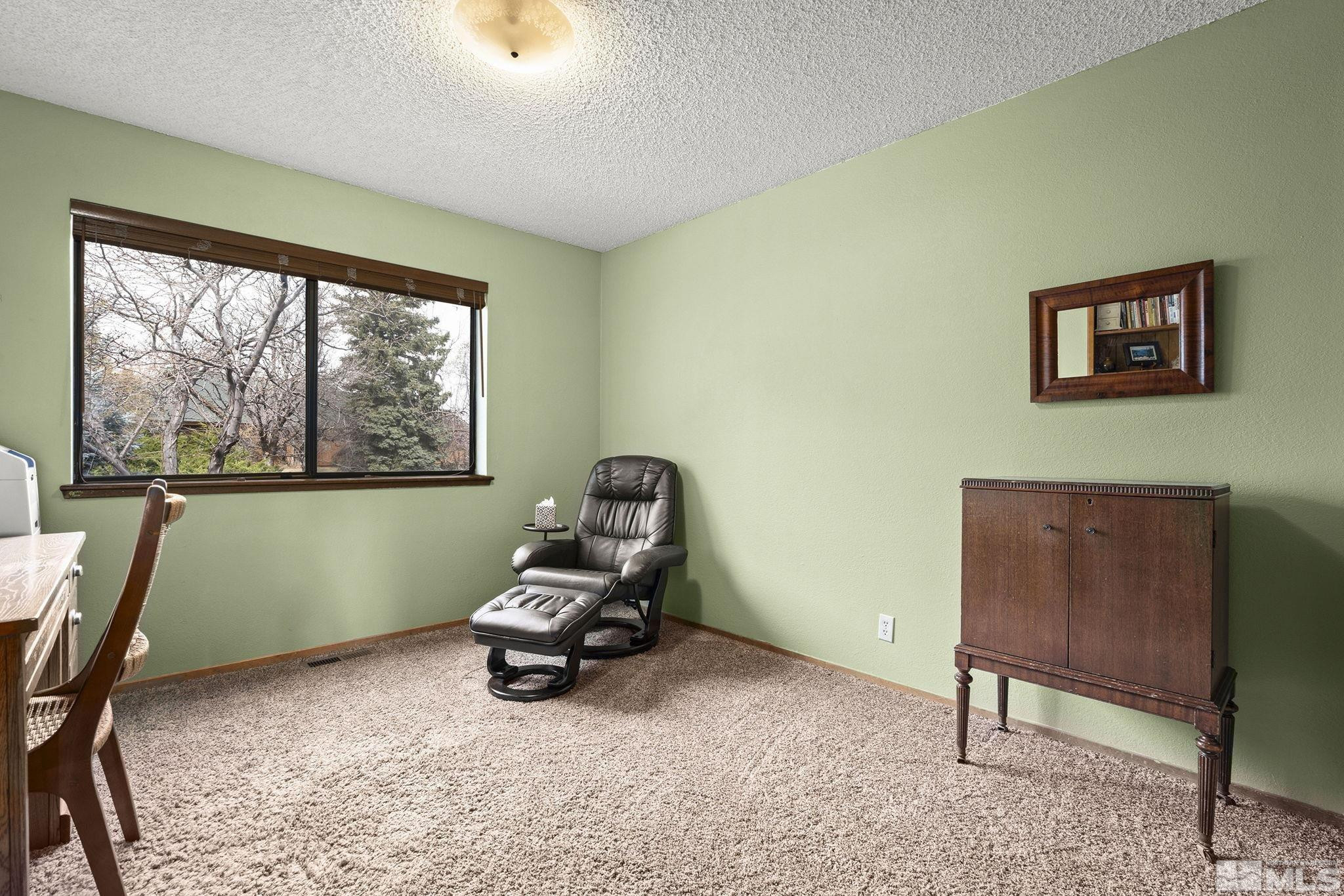 12880 Roseview Lane Reno, NV 89511 - Photo 23 of 34 a view of a workspace with furniture and a window
