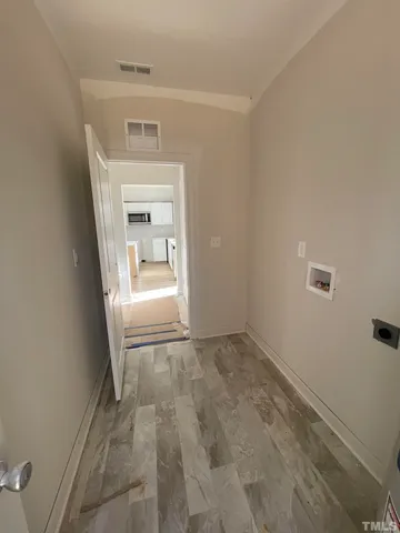 a view of a hallway to a bedroom