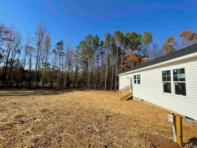a backyard of a house with trees