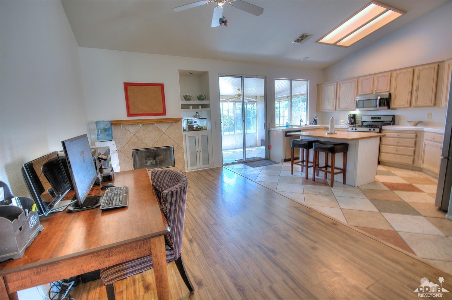 68237 Pasada Road Cathedral City, CA 92234 - Photo 12 of 30 a view of a dining room with furniture window and wooden floor