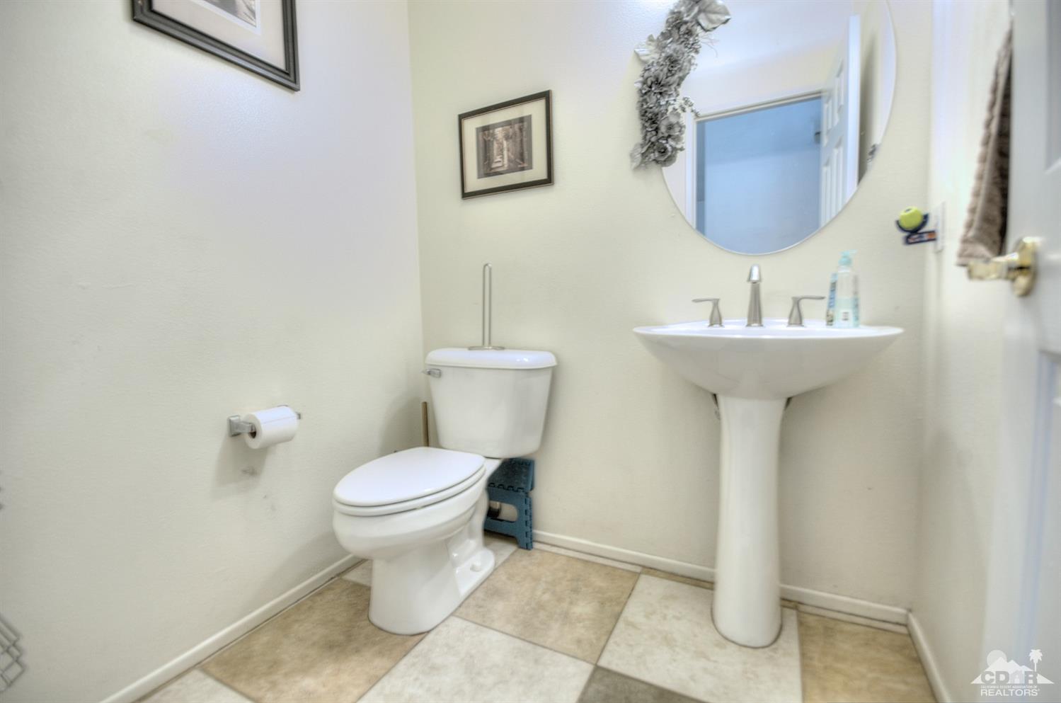 68237 Pasada Road Cathedral City, CA 92234 - Photo 13 of 30 a bathroom with a toilet sink and mirror