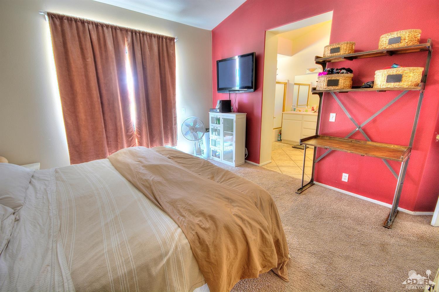 68237 Pasada Road Cathedral City, CA 92234 - Photo 14 of 30 a bedroom with a bed and a tv
