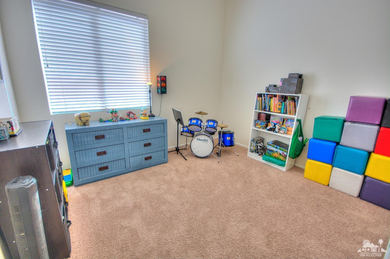 68237 Pasada Road Cathedral City, CA 92234 - Photo 17 of 30 a room with toys and book shelf