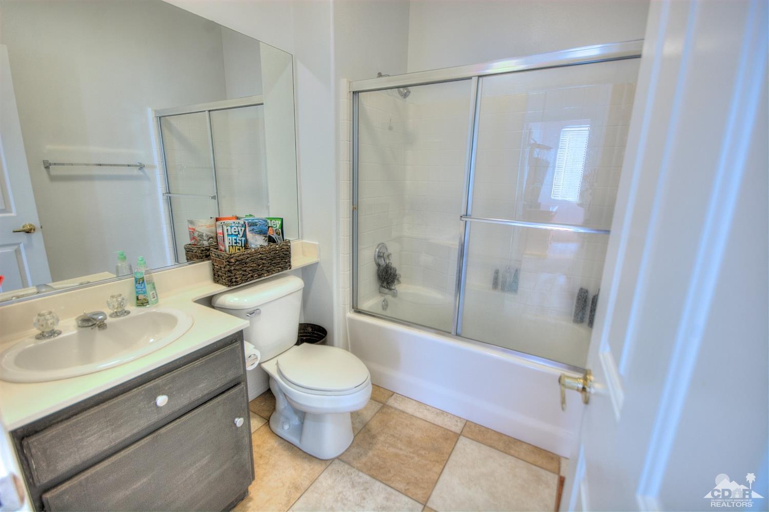 68237 Pasada Road Cathedral City, CA 92234 - Photo 20 of 30 a bathroom with a sink toilet and shower