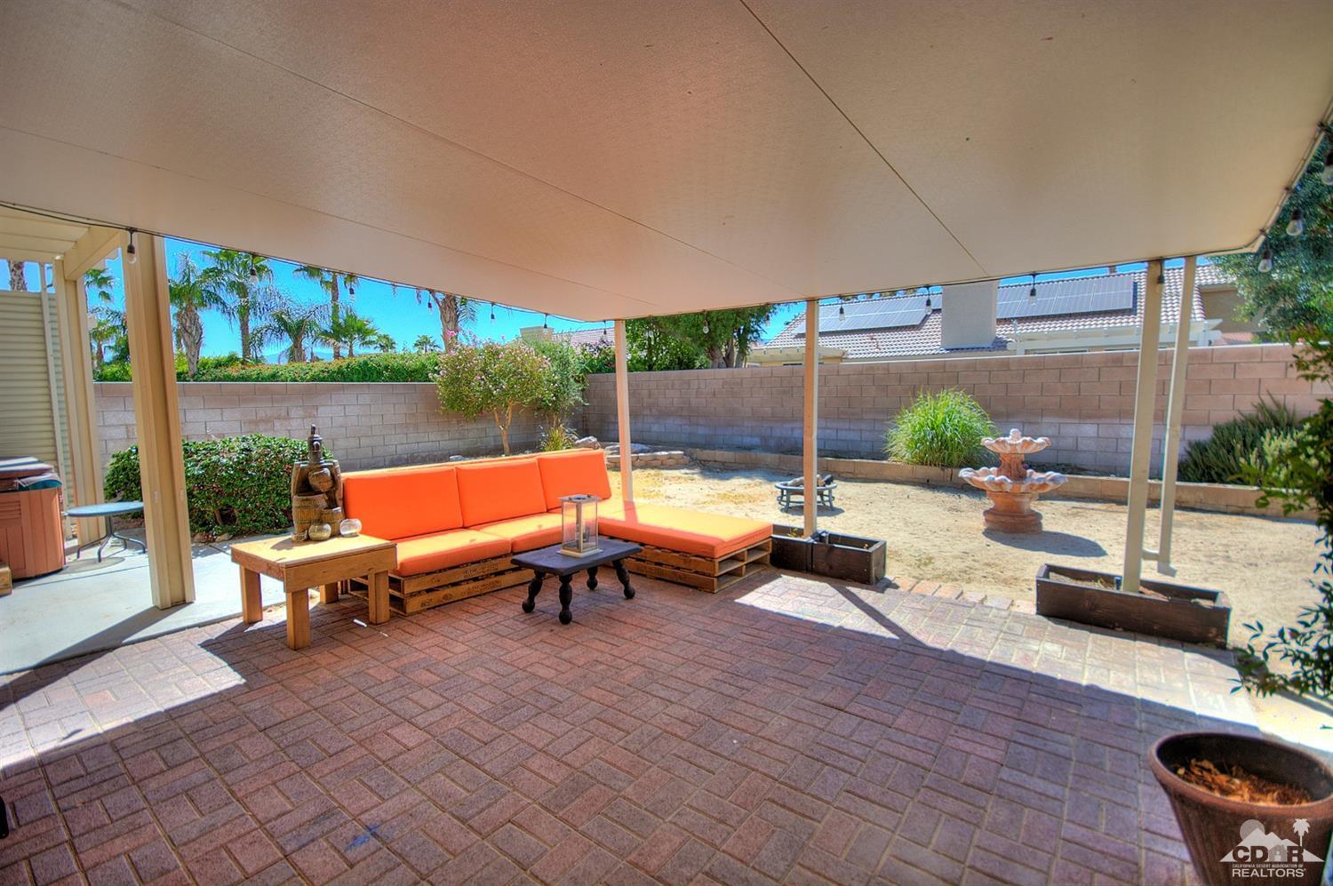 68237 Pasada Road Cathedral City, CA 92234 - Photo 24 of 30 a backyard of a house with outdoor seating