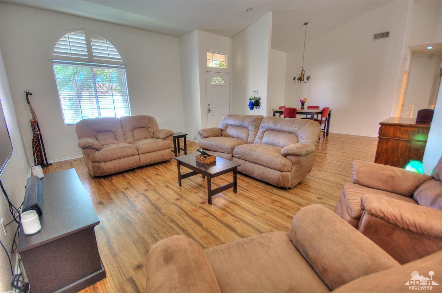 68237 Pasada Road Cathedral City, CA 92234 - Photo 4 of 30 a living room with furniture and a large window