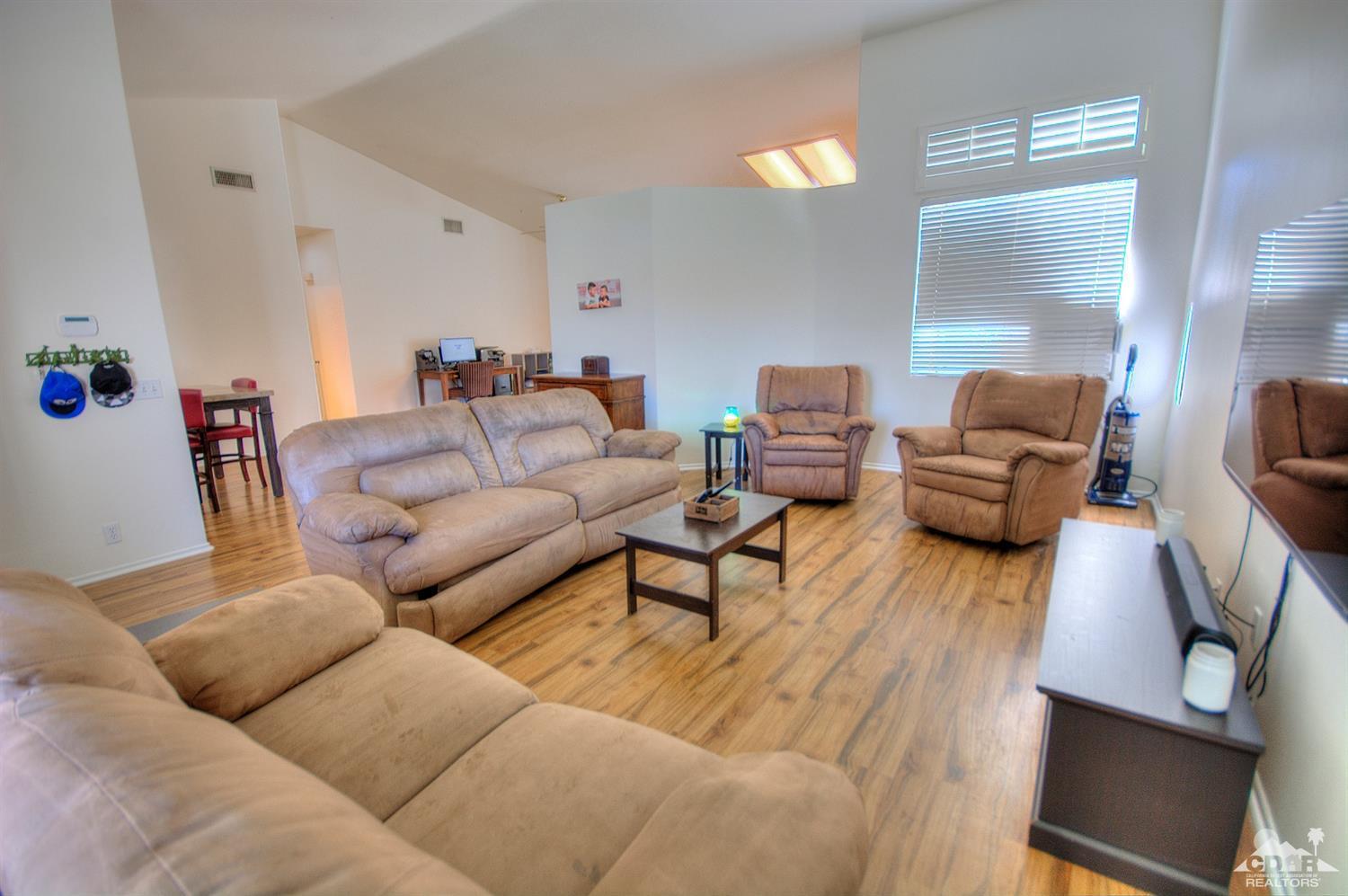 68237 Pasada Road Cathedral City, CA 92234 - Photo 5 of 30 a living room with furniture and wooden floor
