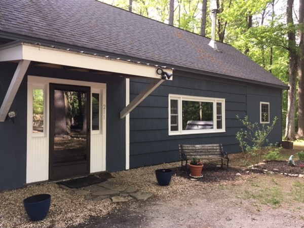 211 South Row Road Lunenburg, MA 01462 - Photo 1 of 19 a backyard of a house with outdoor seating