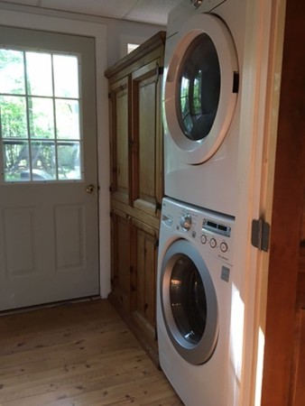 211 South Row Road Lunenburg, MA 01462 - Photo 8 of 19 a view of a hallway with washer and dryer