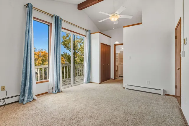 a bathroom with a sink shower view and a mirror