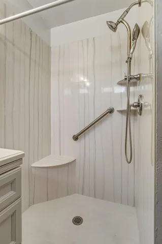 a balcony with wooden floor and fence