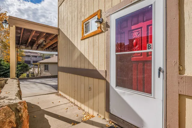 a utility room with stainless steel appliances kitchen island a sink stove and cabinets