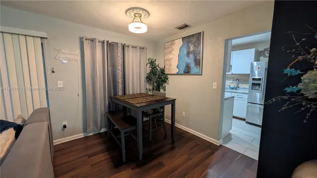 a view of kitchen with furniture and wooden floor