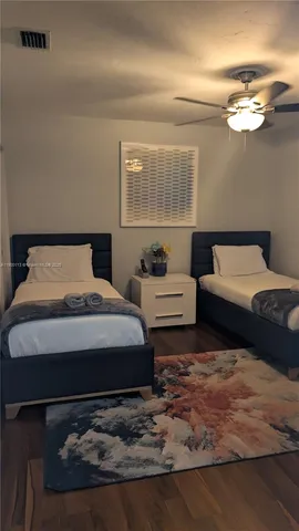 a bathroom with a toilet and a mirror