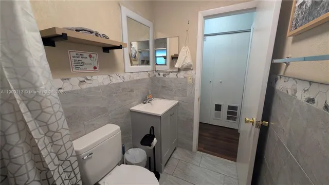 a reading room with furniture and a window