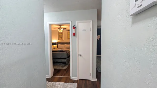 a living room with patio furniture and a floor to ceiling window