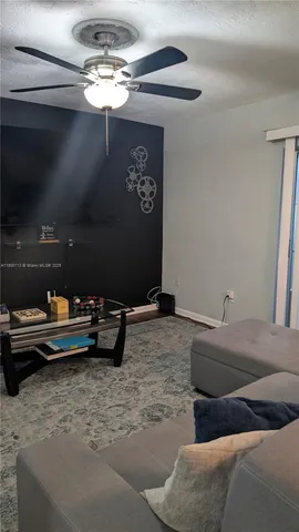 a bed room with a bed and a chandelier