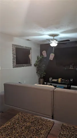 a room with a couch and a flat screen tv